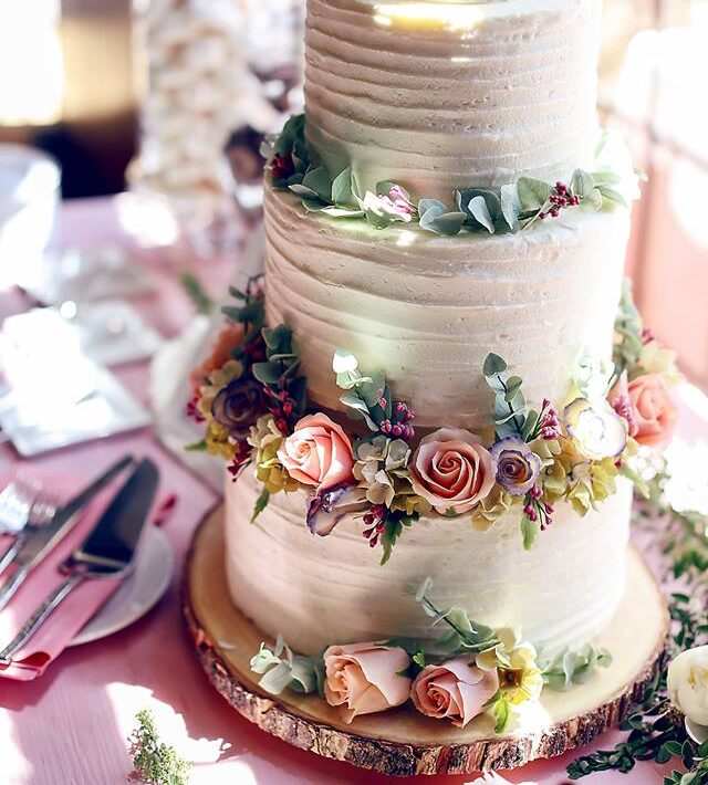 Elegant tiered wedding cake with flowers